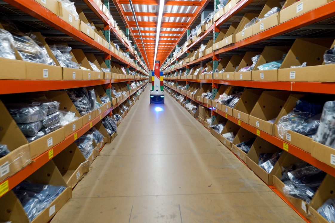 robot doing pick and pack of orders in radial fulfillment center