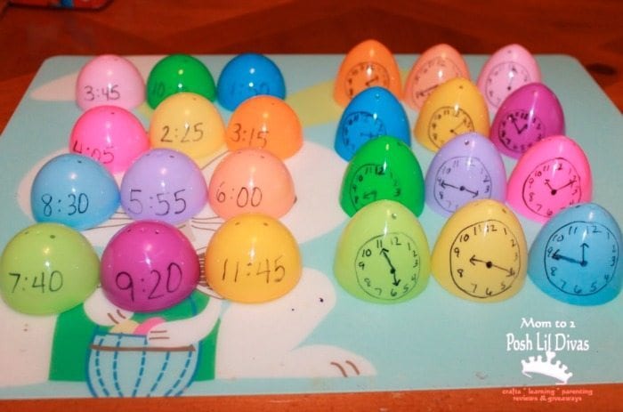 Plastic eggs with times written on one half and clocks drawn on the other halves