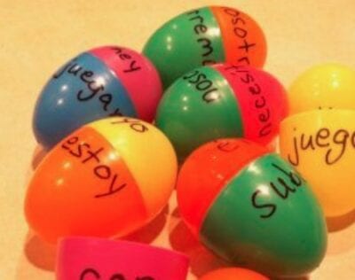 Spanish verbs written on plastic eggs