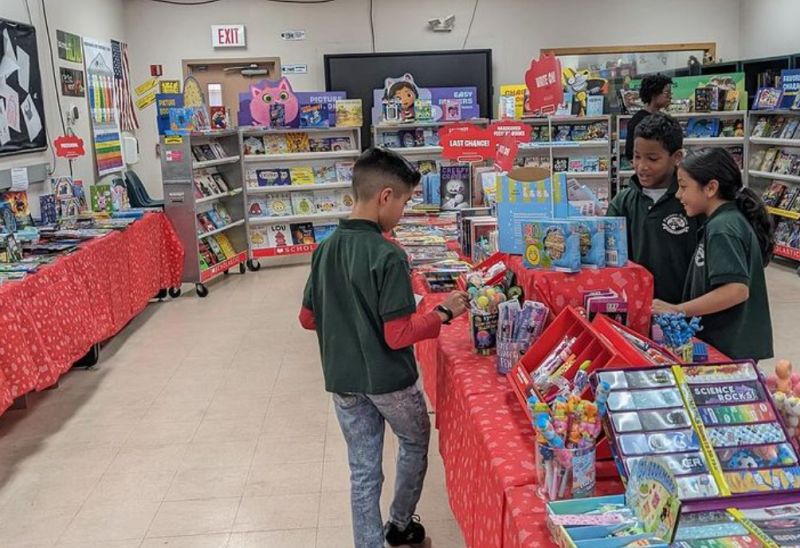 Children browsing at a Scholastic school book fair