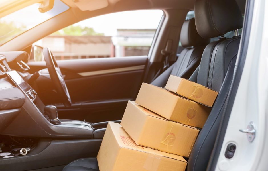 boxes stacked in car to be returned to shipper