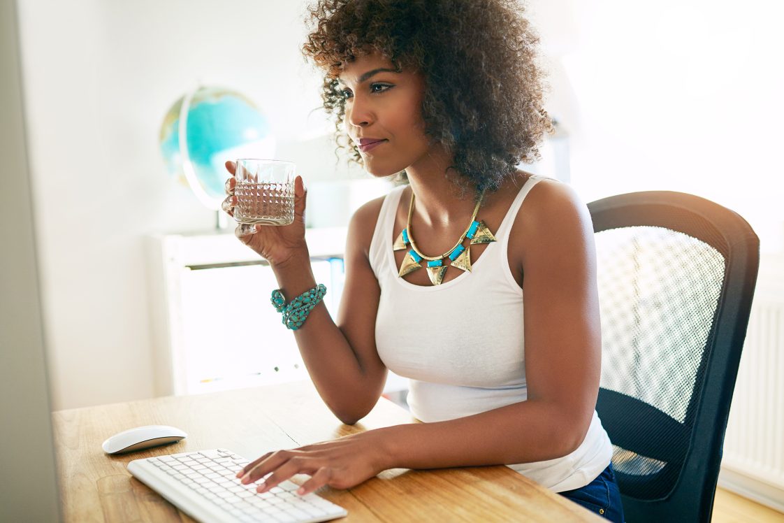 smiling woman with large necklace shopping online