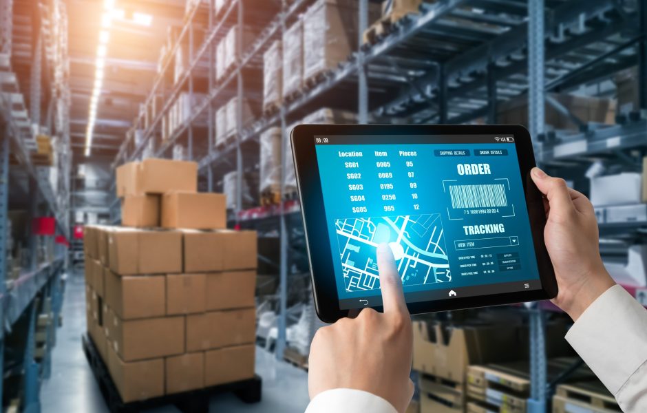 person working on a tablet in a warehouse