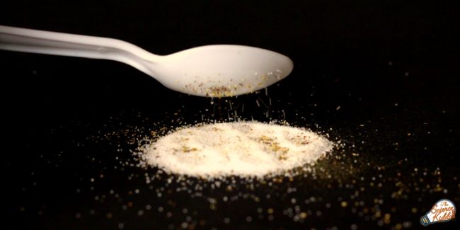 Spoon charged with static electricity separating pepper from salt