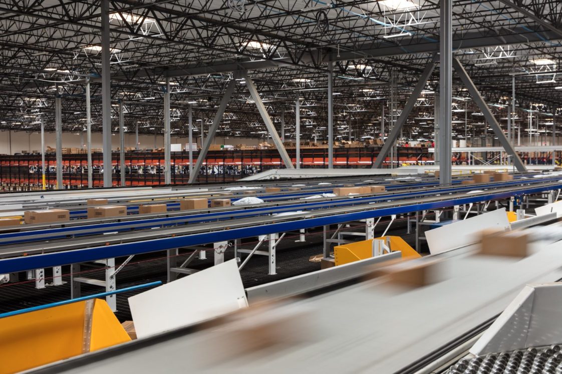 conveyer belt in radial ecommerce fulfillment center