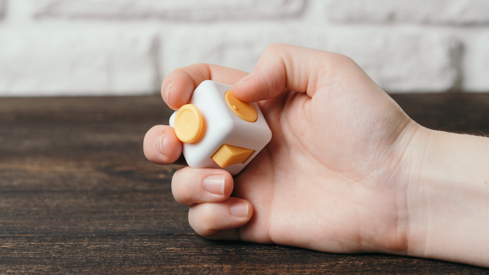 Photo of student hand using fidget toy to represent accommodations mistakes teachers make